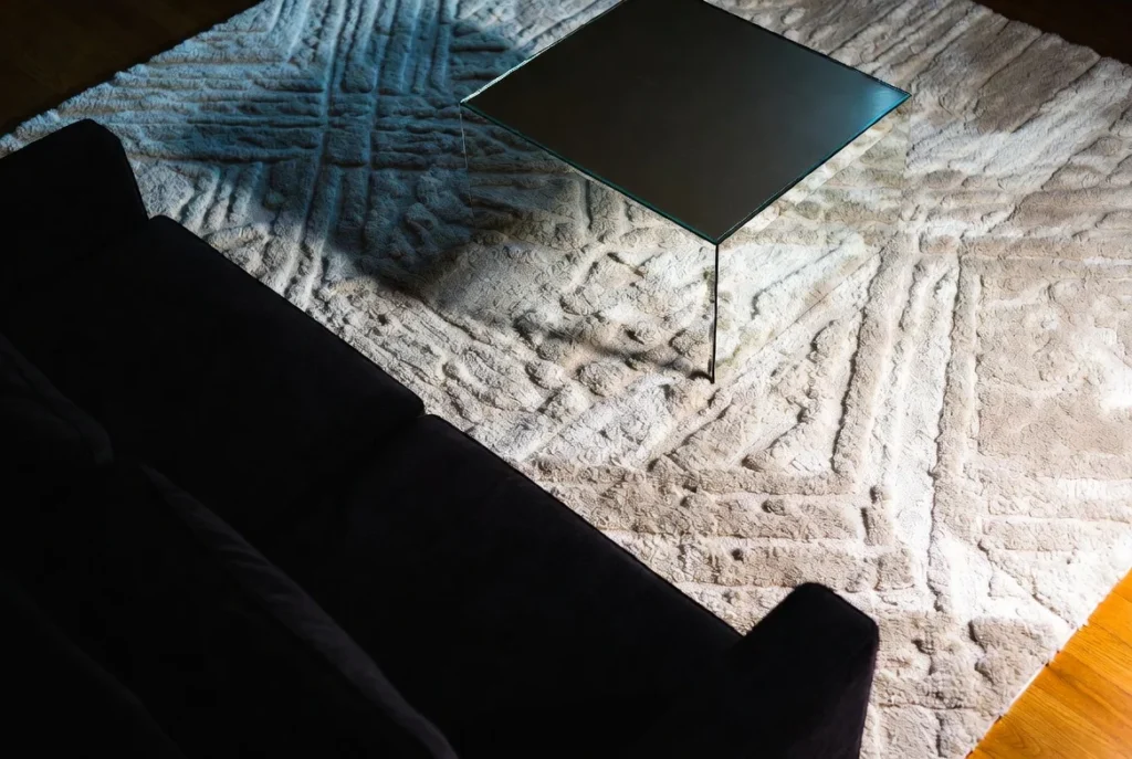 The Best Rugs for a Black Sofa: Anchoring the Room with Confidence